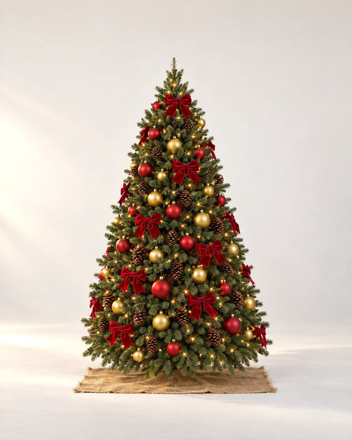 Fraser fir decorated in the Classic Christmas theme beside a cedar-sided front door at dusk