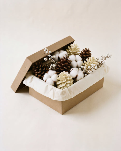 Cotton and Cone Christmas decorations from Gourdgeous Porches, delivered as materials in a kraft box: cotton bolls, brown and bleached pine cones and tallow sprigs
