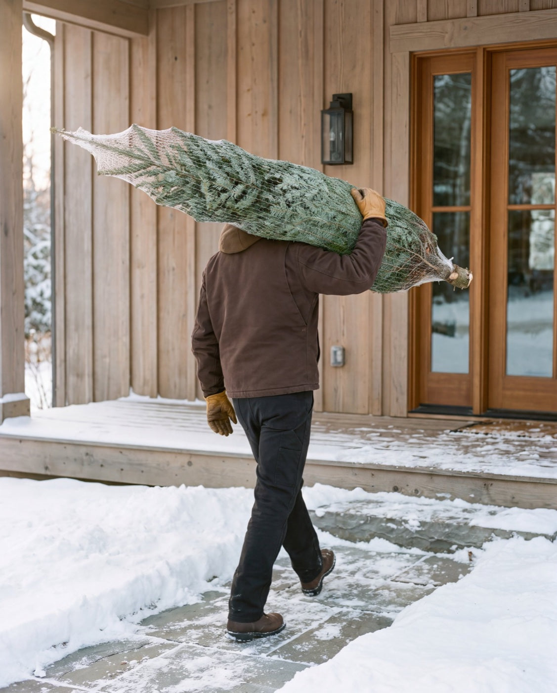 A fresh Fraser fir set at a front door on delivery